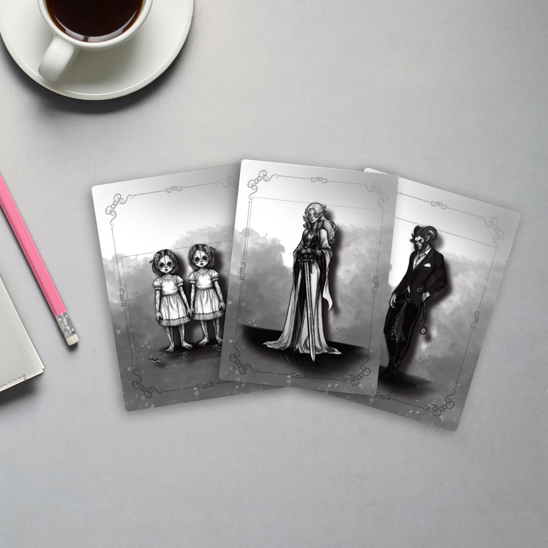 Three black and white illustrated cards, with a cup of coffee and pink pencil on a gray desk.