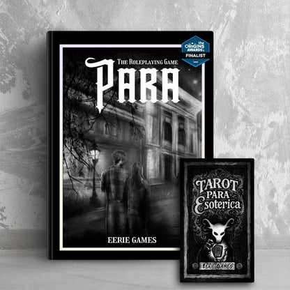 A book titled 'PARA The Roleplaying Game' leans against a grey wall. The cover is drawn in a black and white sketch style with a masculine and feminine person facing away, looking at a college building at night. In front of the book sits a box of tarot cards with the white skulled Eerie Games mascot shuffling a deck. 
