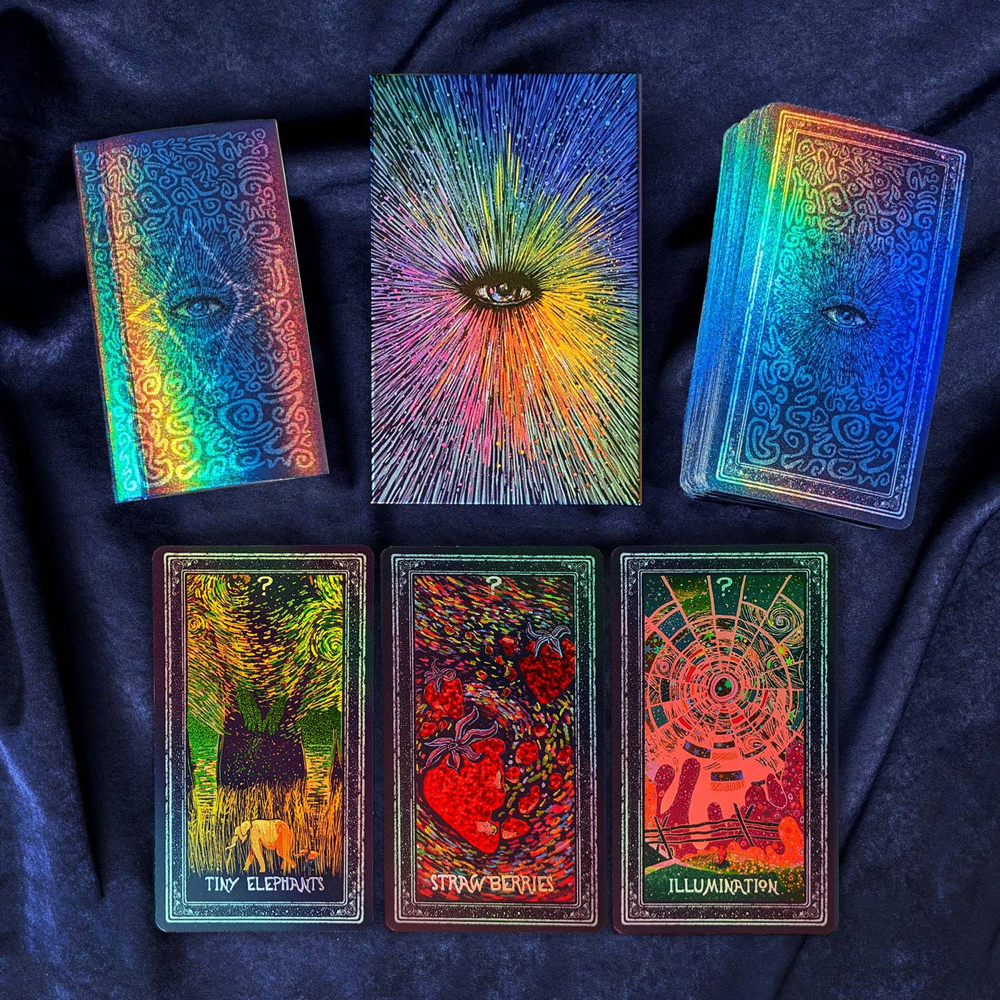 Set of colorful tarot cards on a dark fabric background